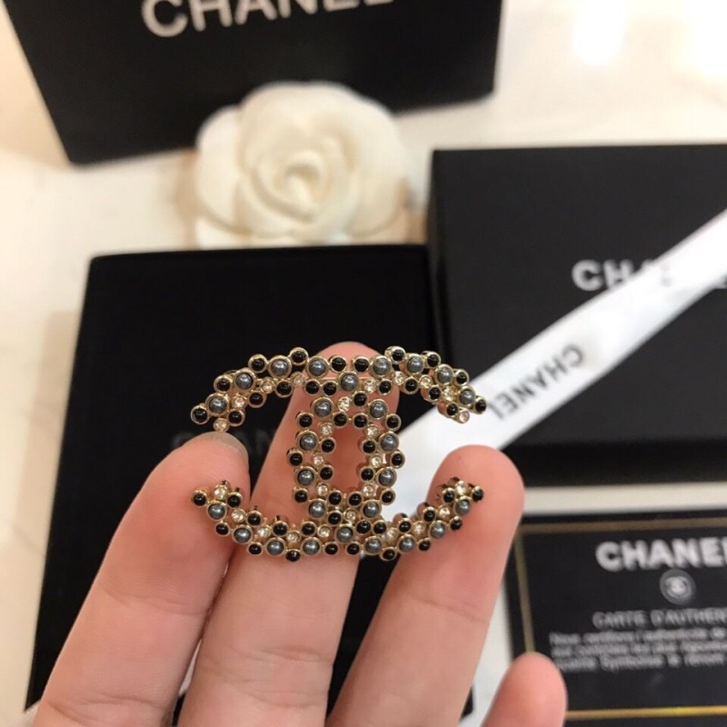 Ch*el brooches